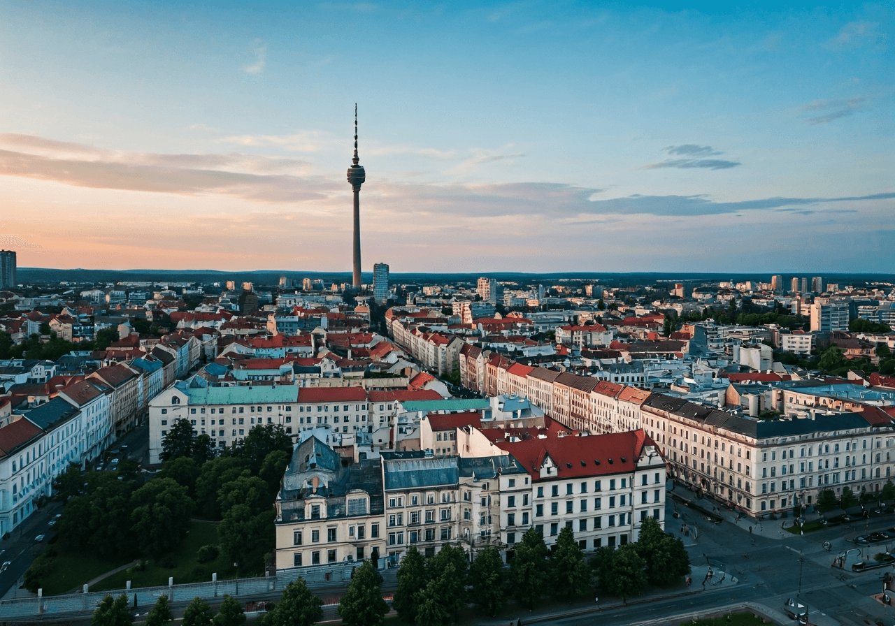 PSČ Liberce: Kompletní přehled (Rychle za 30s) 2 Aerial view of Liberec city center with historical architecture and modern Ještěd tower in the distance, editorial photography, soft natural light, 85mm lens, high resolution, no text, no letters