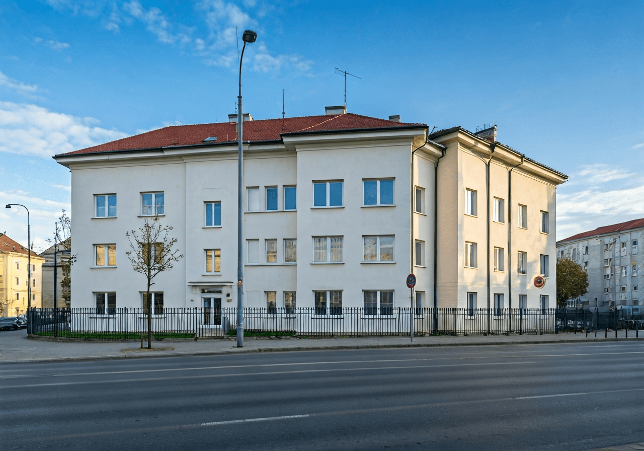 Exterior view of a modern Czech post office branch, clean street architecture, Jihlava urban environment, soft natural daylight, 85mm lens, professional editorial photography, no text, no words, no letters.