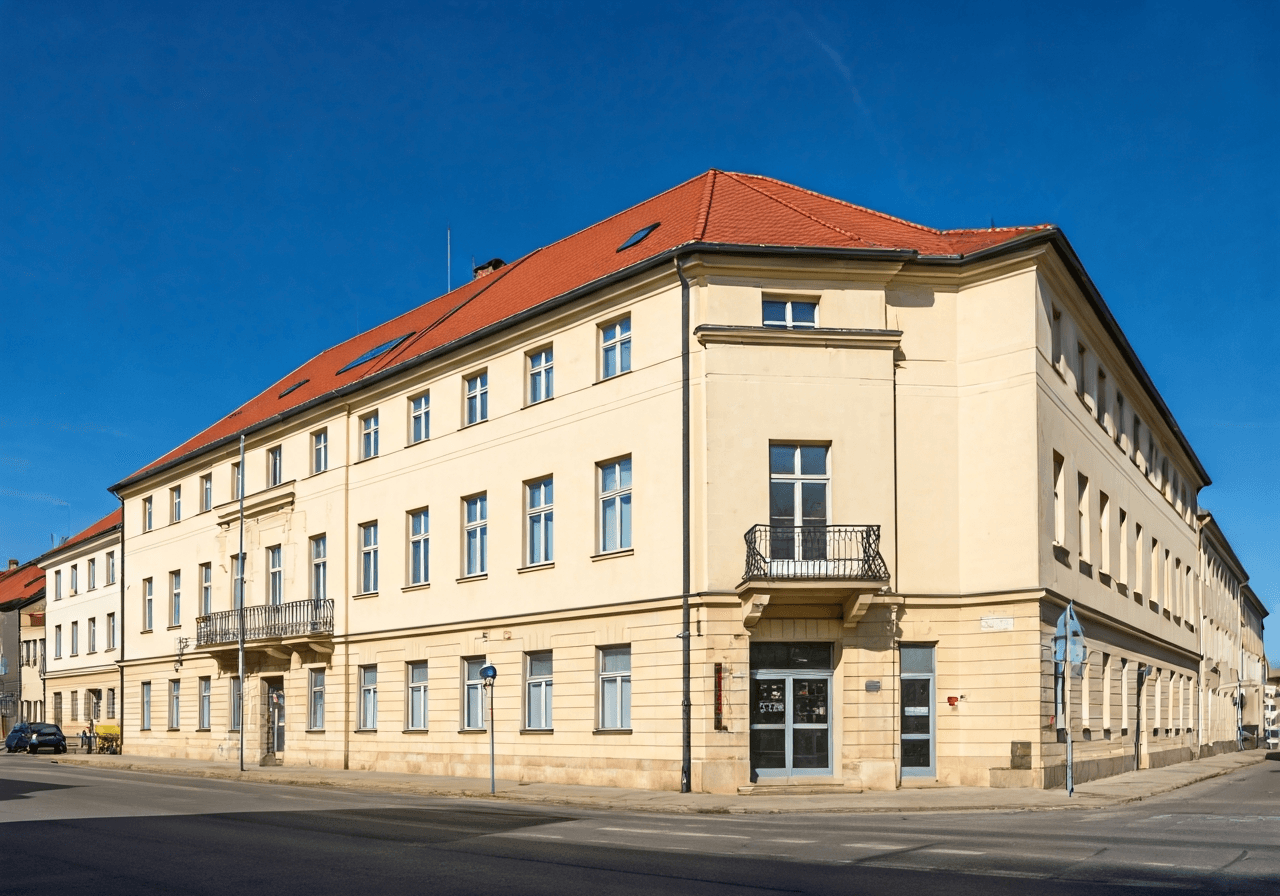 Exterior view of a traditional post office building in Humpolec, Havlíčkovo náměstí, sunny day with clear blue sky, architectural photography, sharp focus, clean lines, professional aesthetic, 85mm lens, no text, no words, no letters