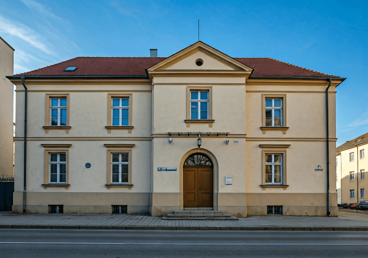 Exterior view of a traditional Czech post office building in Strašice, clean daylight, architectural photography, premium aesthetic, soft shadows, 85mm lens, no text, no words, no letters