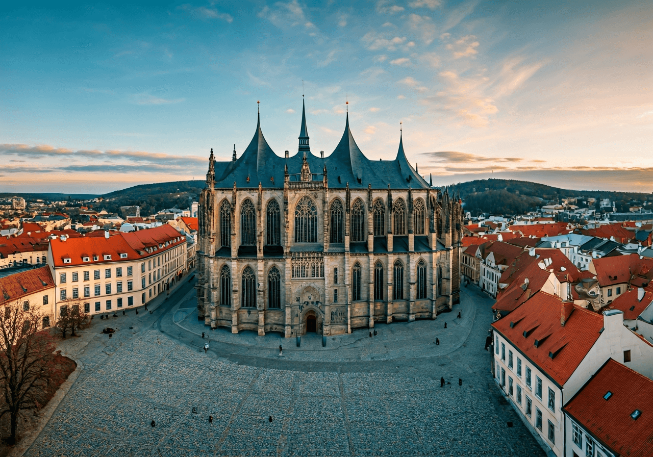 Aerial view of the historical city center of Kutna Hora, iconic cathedral and architectural landmarks, soft daylight, 85mm lens, high-end travel photography, no text, no words, no letters