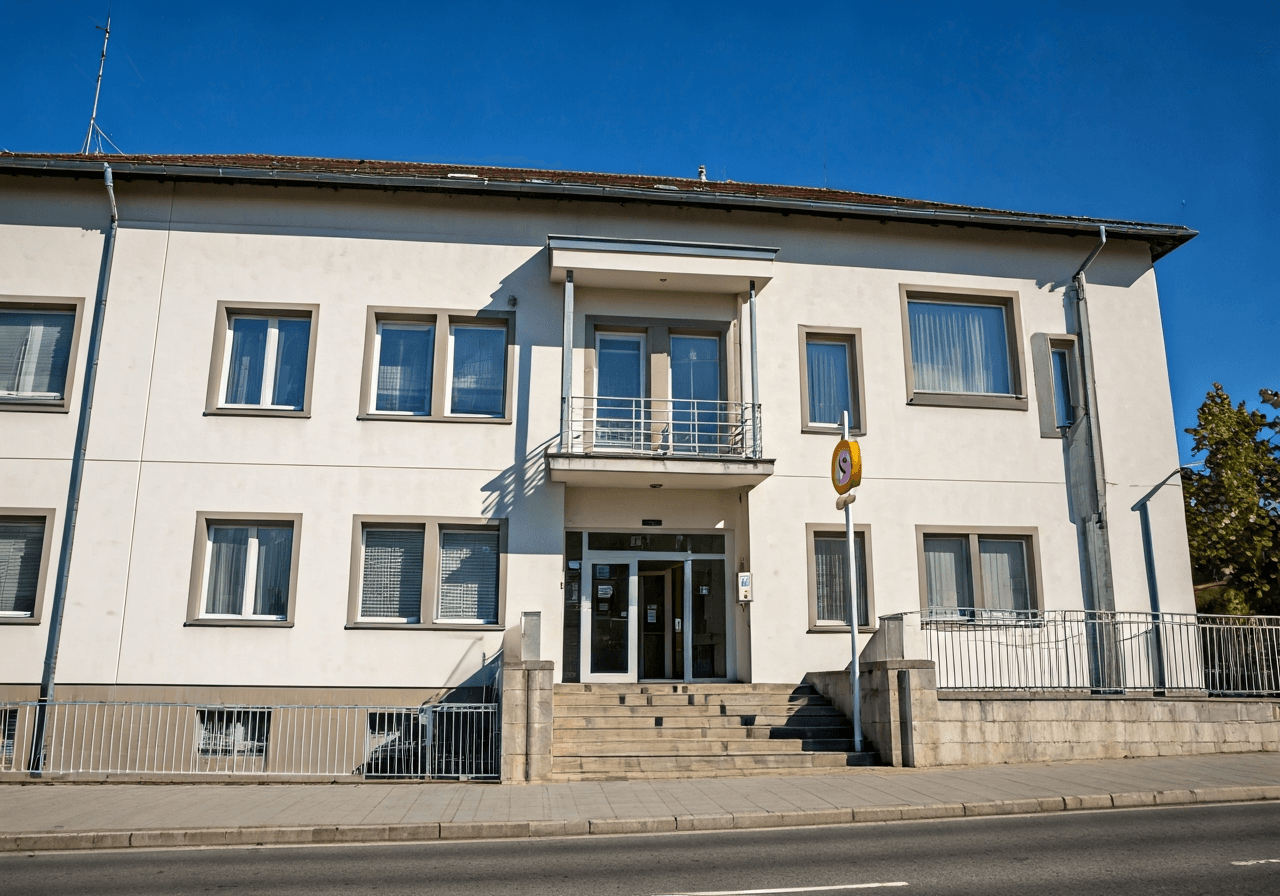 A professional exterior shot of the Czech post office building in Nové Město na Moravě, modern clean aesthetic, soft natural daylight, 85mm lens, high quality editorial photography, no text, no letters.