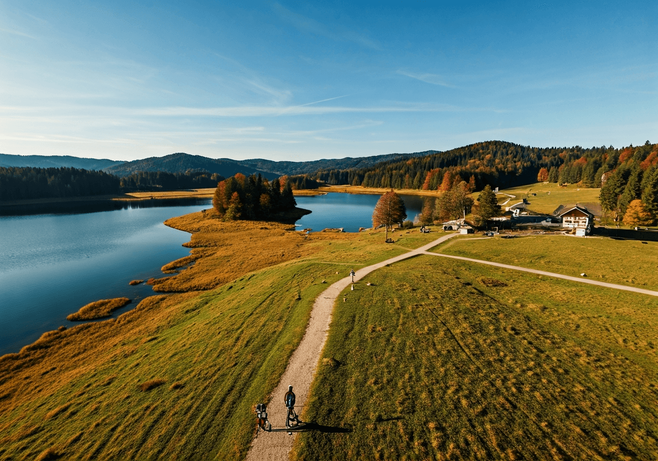 Aerial view of Hlucin lake area during a sunny autumn day with people hiking and cycling, peaceful landscape, editorial photography, soft natural light, 85mm lens, highly detailed, no text, no letters