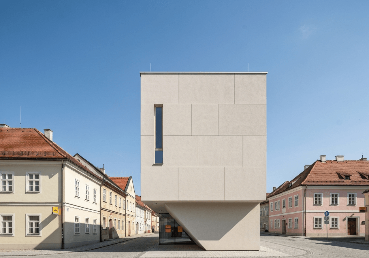 A clean, modern exterior of a Czech post office building in a picturesque town, minimalist architectural style, bright daylight, 85mm lens, high quality editorial photography, no text, no letters.