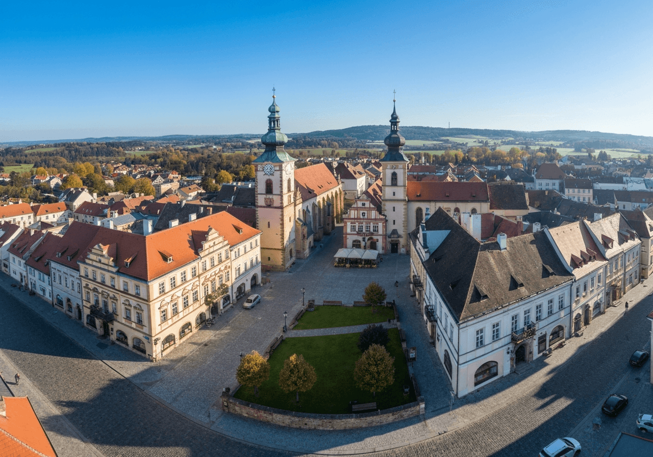 Aerial view of the historic town square of Pelhrimov, Czech Republic, clean morning light, architectural photography, sharp details, wide angle, no text, no letters